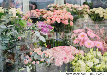 Flowers for sale in a special cold room, warehouse with air conditioning. Refrigerator for flowers. florist shop, boutique. 86235252