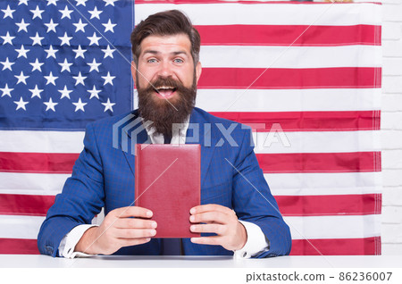 American writer bearded man presenting book, books store concept 86236007