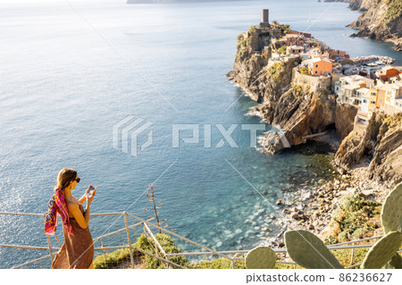 Woman traveling famous Cinque Terre towns in northwestern Italy Woman traveling famous Cinque Terre towns in northwestern Italy 86236627