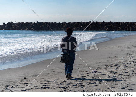 Walking on a sandy beach Walking on a sandy beach 86238576