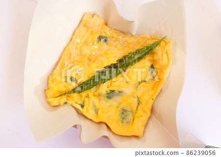 Roti with cannabis leaf on paper. Roti with cannabis leaf on paper. 86239056