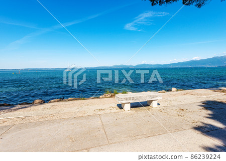 Lakeshore and Stone Bench - Lake Garda Lazise Verona Italy 86239224
