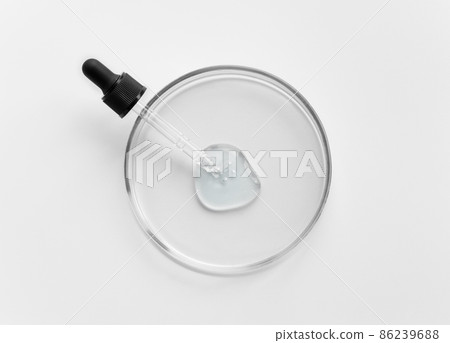 Laboratory glass petri with pipette and drop of water, serum, oil, beauty product. Natural medicine, cosmetic research, bio science. Concept of skincare and analysis. Dermatology. Flat lay, top view Laboratory glass petri with pipette and drop of water, serum, oil, beauty product. Natural medicine, cosmetic research, bio science. Concept of skincare and analysis. Dermatology. Flat lay, top view 86239688