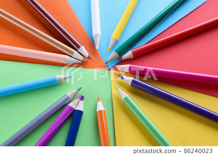 Lot of sharp wooden pencils lying on multicolored background closeup Lot of sharp wooden pencils lying on multicolored background closeup 86240023