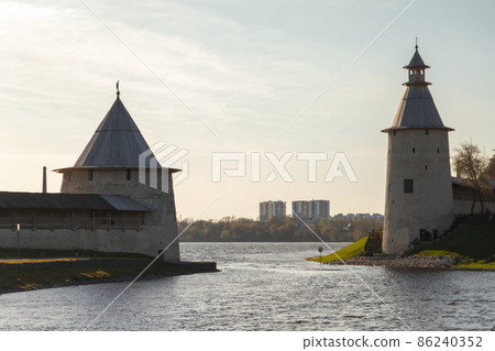 Stone towers at the river coast, Kremlin of Pskov 86240352