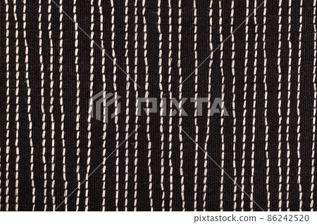 Black fabrick with white stitches background texture Black fabrick with white stitches background texture 86242520