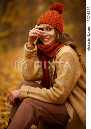 Beautiful autumn portrait of woman in forest Beautiful autumn portrait of woman in forest 86242834