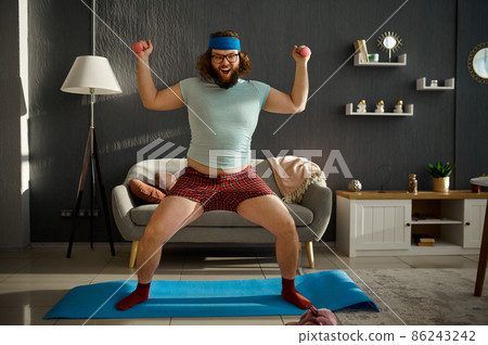 Funny oversize man showing strong muscles power 86243242