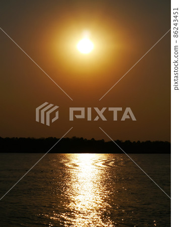 Sunset from the Zambezi River Cruise in Africa Sunset from the Zambezi River Cruise in Africa 86243451