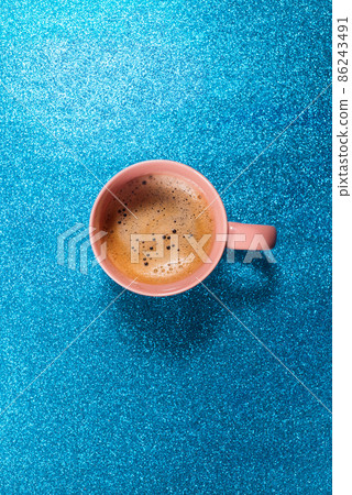 One cup hot fresh coffee on bright blue color paper 86243491