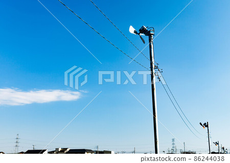 Anti-frost fans in the fields and clear blue sky 86244038