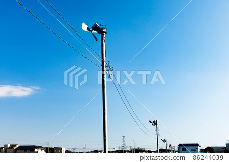 Anti-frost fans in the fields and clear blue sky 86244039