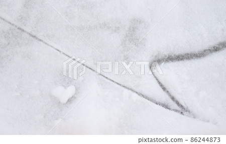 Ice background with marks from skating and hockey, blue texture of rink surface with many scratches Ice background with marks from skating and hockey, blue texture of rink surface with many scratches 86244873