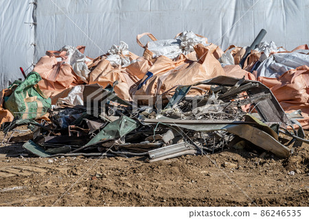 Metal scraps and flexible container bags removed during demolition work Metal scraps and flexible container bags removed during demolition work 86246535