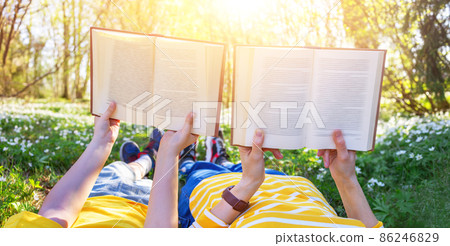 Mother and her son lying down on the beautiful spring field in the sunny park. Mother and her son lying down on the beautiful spring field in the sunny park. 86246829