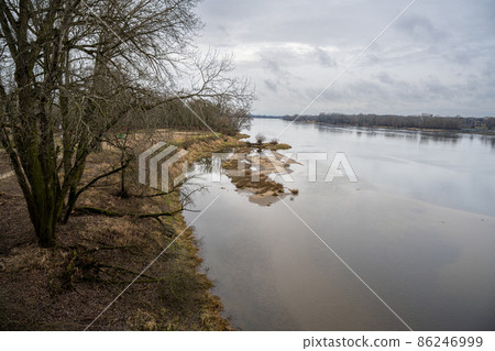 A view of the Vistula River in Torun, north-central Poland. The clouds reflected in the water A view of the Vistula River in Torun, north-central Poland. The clouds reflected in the water 86246999