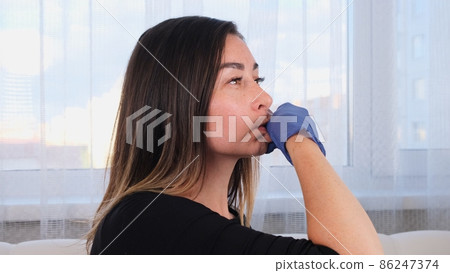Intra oral neuromuscular massage. Female professional beautician makes facial massage to herself Intra oral neuromuscular massage. Female professional beautician makes facial massage to herself 86247374
