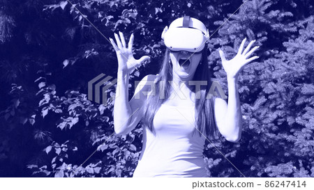 scared female in virtual reality glasses screams in horror from the fear of what he saw on the scared female in virtual reality glasses screams in horror from the fear of what he saw on the 86247414