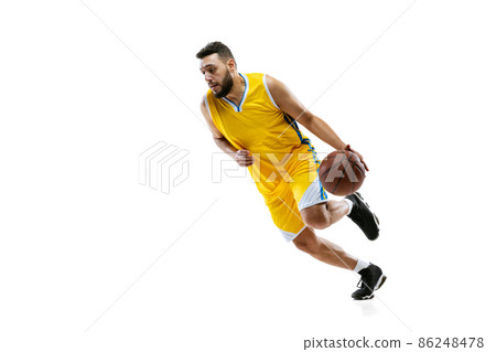 Full length portrait of professional basketball player training isolated on white studio background. Sport, motion, activity, movement concepts. 86248478