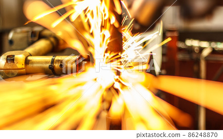 Sparks while cutting steel in the factory Sparks while cutting steel in the factory 86248870