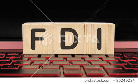 FDI a word on wooden cubes on the illuminated laptop keyboard FDI a word on wooden cubes on the illuminated laptop keyboard 86249254