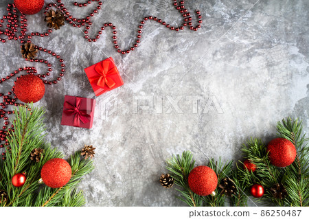 Branches of a Christmas tree with cones, Christmas balls , on a light background.Top view. Perfect Christmas background Branches of a Christmas tree with cones, Christmas balls , on a light background.Top view. Perfect Christmas background 86250487