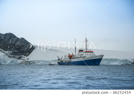 Expedition ship, cruise in Antarctic landscape, Paulet island, near the Antarctic Peninsula Expedition ship, cruise in Antarctic landscape, Paulet island, near the Antarctic Peninsula 86252454