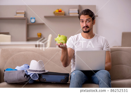 Young man preparing for trip at home 86252531