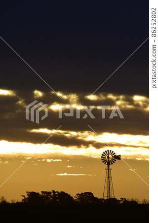 Landscape with windmill at sunset, Pampas, Patagonia,Argentina Landscape with windmill at sunset, Pampas, Patagonia,Argentina 86252802