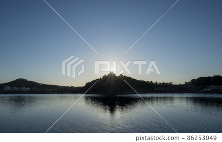 The sun rising from behind the castle tower of Inuyama Castle The sun rising from behind the castle tower of Inuyama Castle 86253049