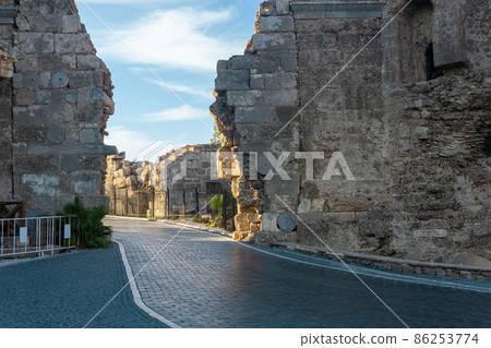 road passes through the ancient Vespasian Gate in Side, Turkey road passes through the ancient Vespasian Gate in Side, Turkey 86253774