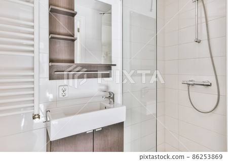 Luxury interior design of a bathroom with marble walls Luxury interior design of a bathroom with marble walls 86253869