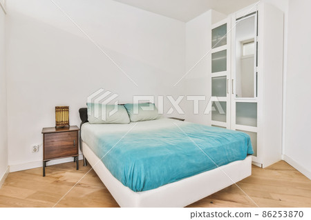 Beautiful bedroom in new luxury home with some decor 86253870
