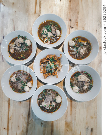 Braised beef clear noodle with meat ball soup stew 86256294