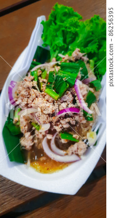 Spicy minced pork salad (Laab) at Thai street food Spicy minced pork salad (Laab) at Thai street food 86256395