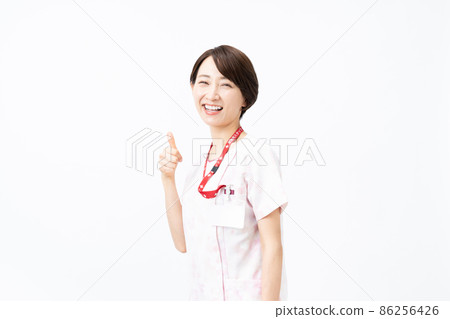 Female nurse wearing a pink floral scrub (white background) 86256426