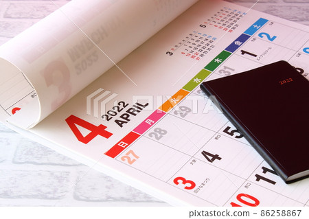 A notebook and a calendar 86258867