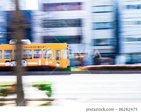 Tram running through the office district Tram running through the office district 86262475