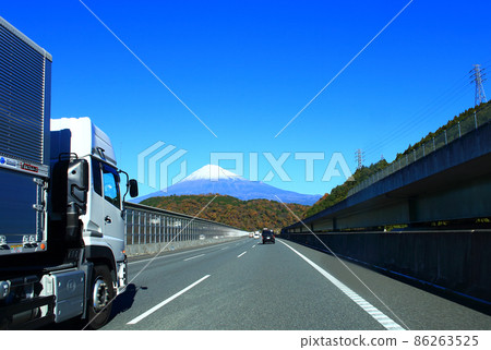 Trucks traveling on the Shin Tomei Expressway and Mt. Fuji 86263525
