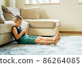 Young boy playing in smartphone. 86264085