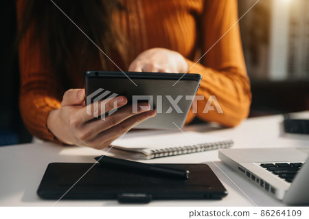 business documents on office table with smart phone and digital tablet and graph financial 86264109