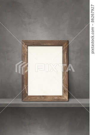 Wooden picture frame leaning on a grey shelf. 3d illustration. Vertical background 86267927