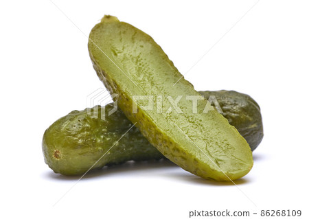 Tasty Whole green cornichon isolated on a white background Tasty Whole green cornichon isolated on a white background 86268109