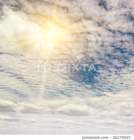 Bright sun on blue sky 86270685