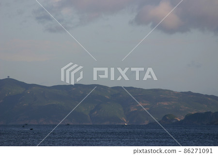 a Seascape with beautiful green island on cloudy day a Seascape with beautiful green island on cloudy day 86271091