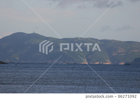 a Seascape with beautiful green island on cloudy day a Seascape with beautiful green island on cloudy day 86271092