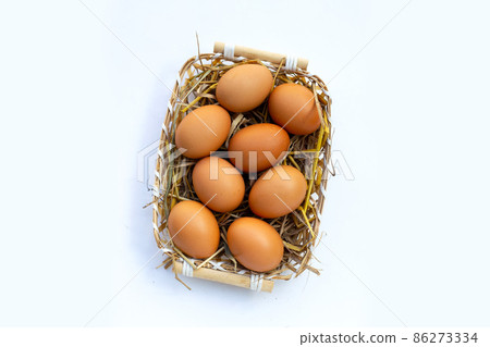 Fresh organic eggs in bamboo basket Fresh organic eggs in bamboo basket 86273334