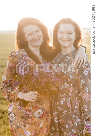 Beautiful girls on the meadow 86273992