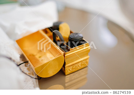 a box with a set for chrismation and hair circumcision at baptism. a box with a set for chrismation and hair circumcision at baptism. 86274539