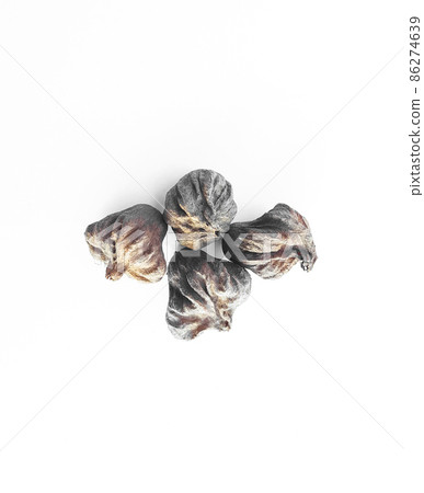 Isolated dried brown teak seeds on white background Isolated dried brown teak seeds on white background 86274639
